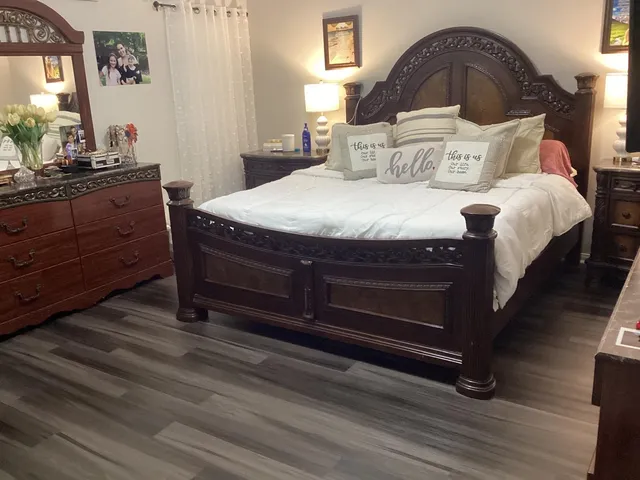 a bedroom with a bed and a dresser