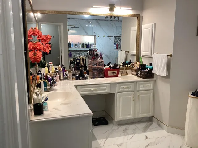 a room with mirror and sink