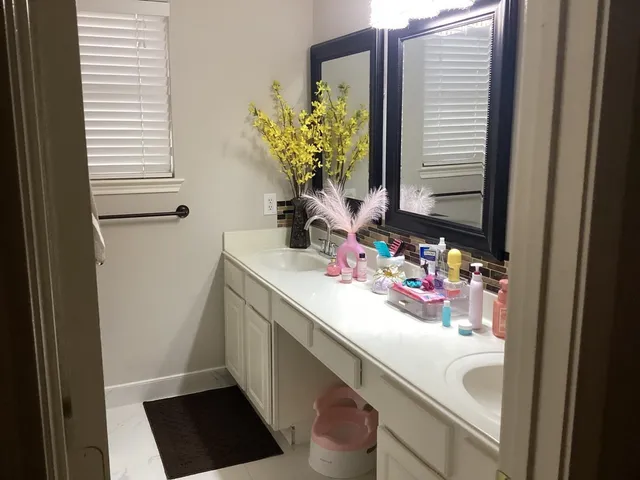 a bathroom with a sink and a mirror