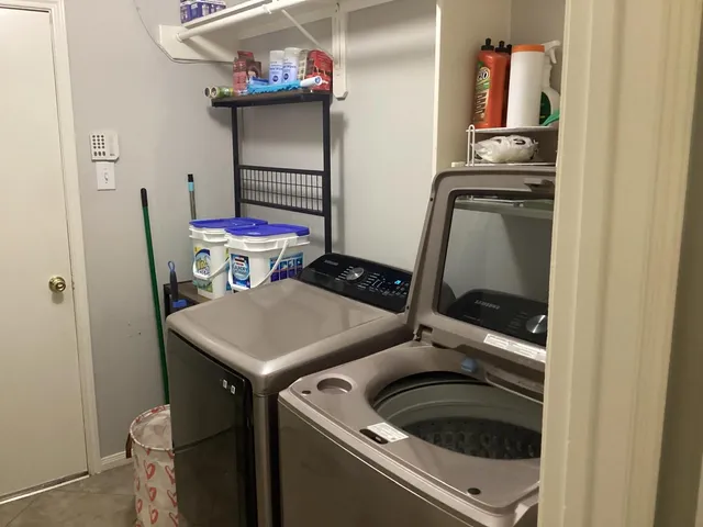 a utility room with dryer and washer