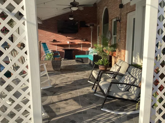 a room with patio outer view and outdoor seating