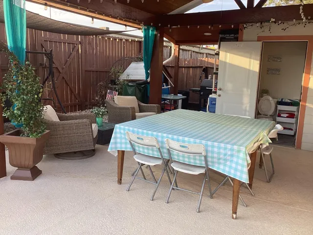 a outdoor space with a couch and chairs