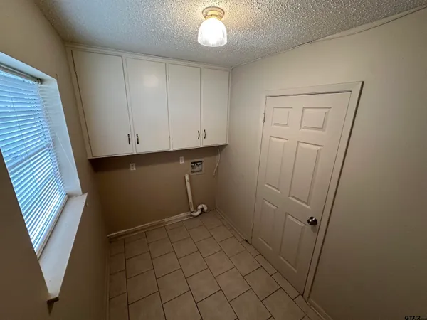 a view of an empty room with windows