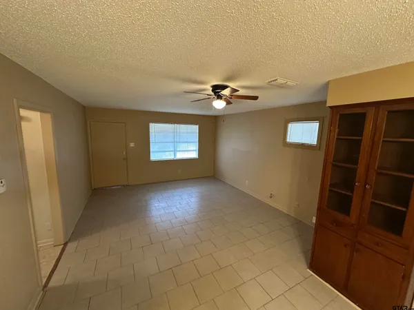 a view of an empty room with a window