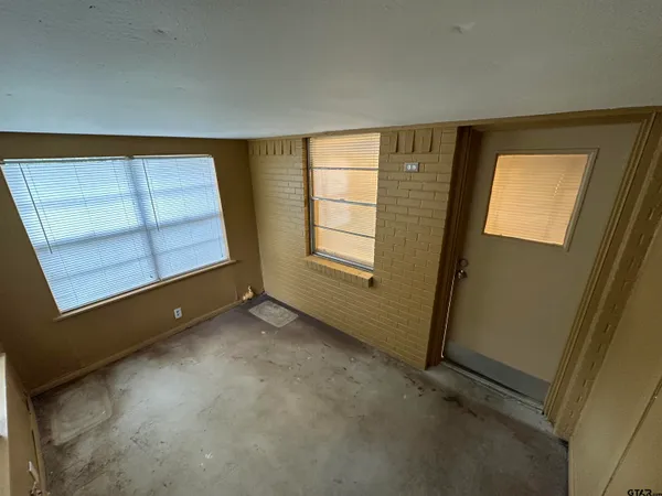 an empty room with windows