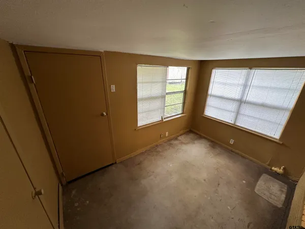 an empty room with windows