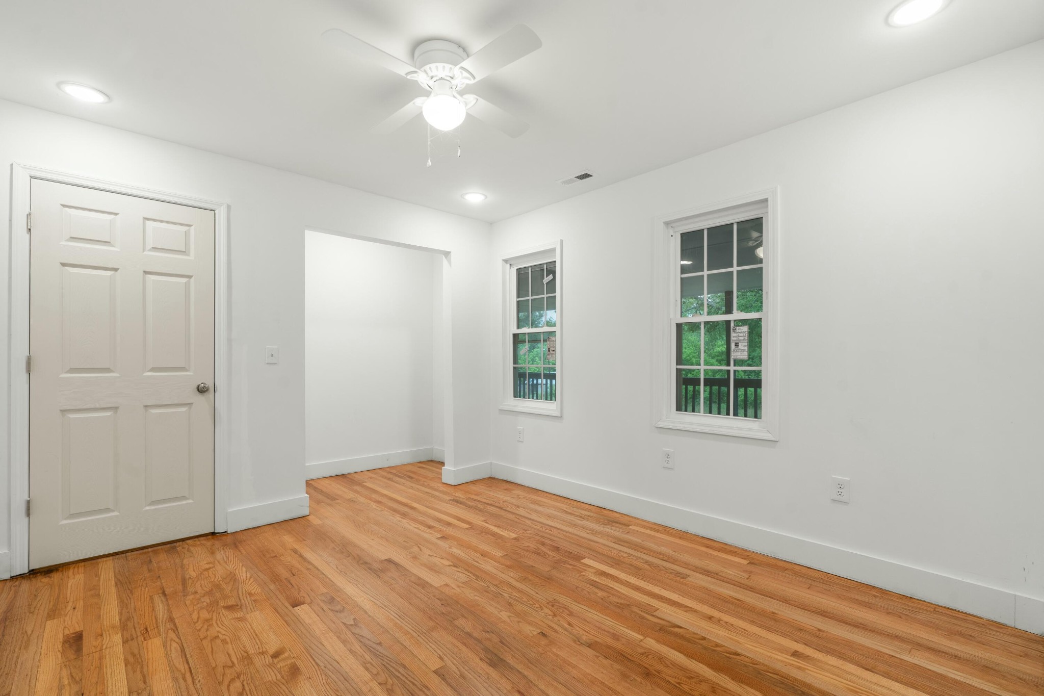 6416 Spring Place Road Southeast Cleveland, TN 37323 - Photo 13 of 28 wooden floor in an empty room with a window