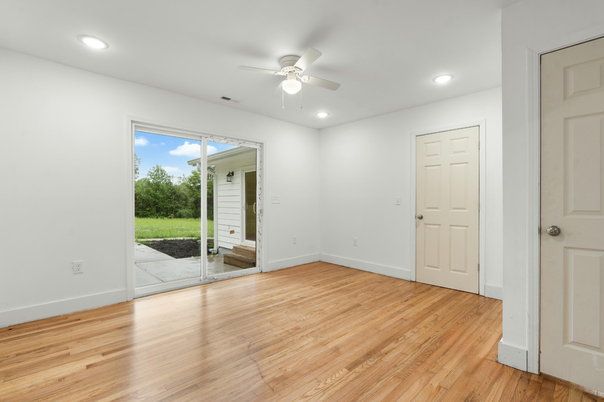 6416 Spring Place Road Southeast Cleveland, TN 37323 - Photo 17 of 28 a view of an empty room with wooden floor and a window