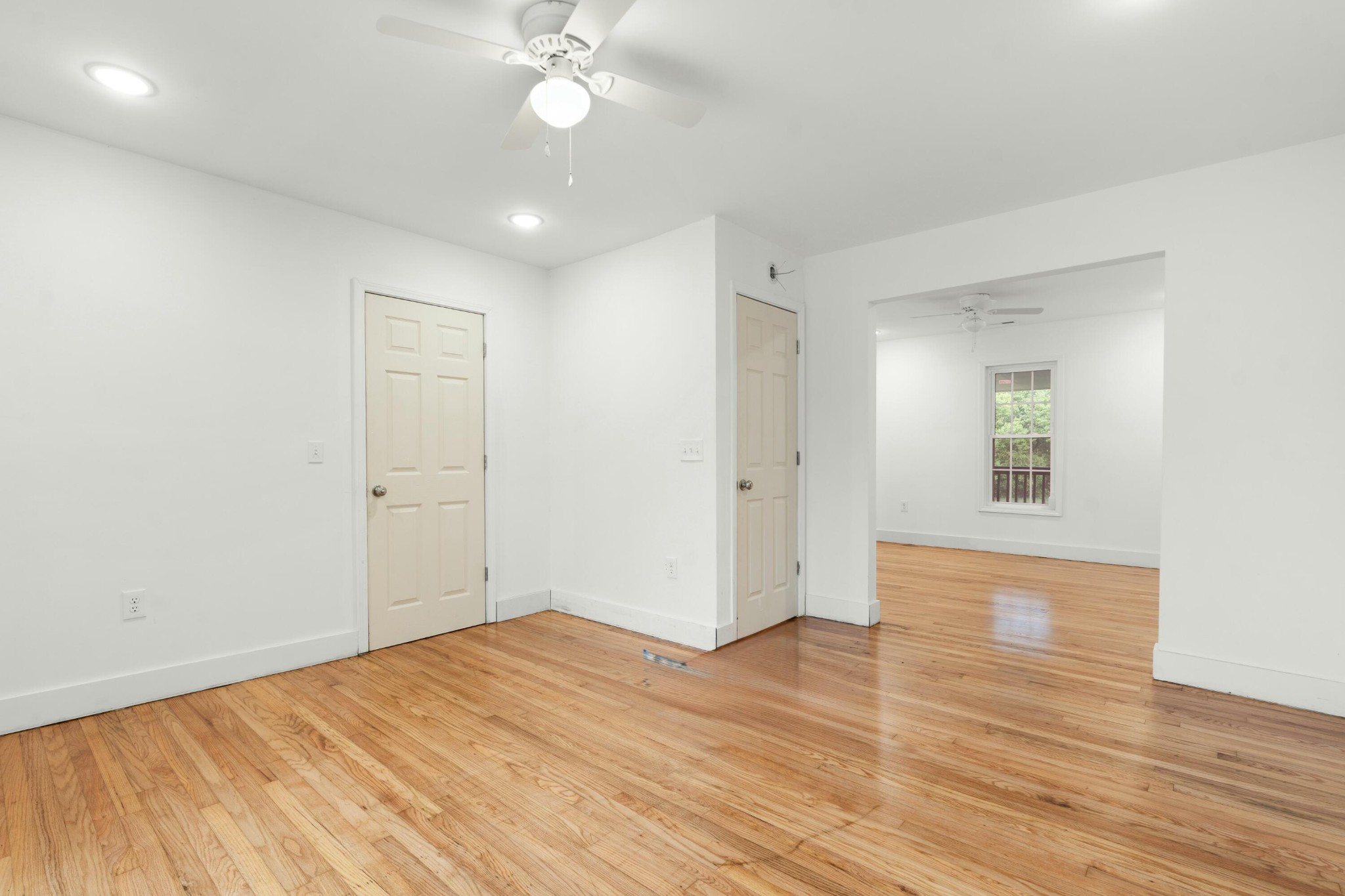 6416 Spring Place Road Southeast Cleveland, TN 37323 - Photo 18 of 28 an empty room with wooden floor and fan