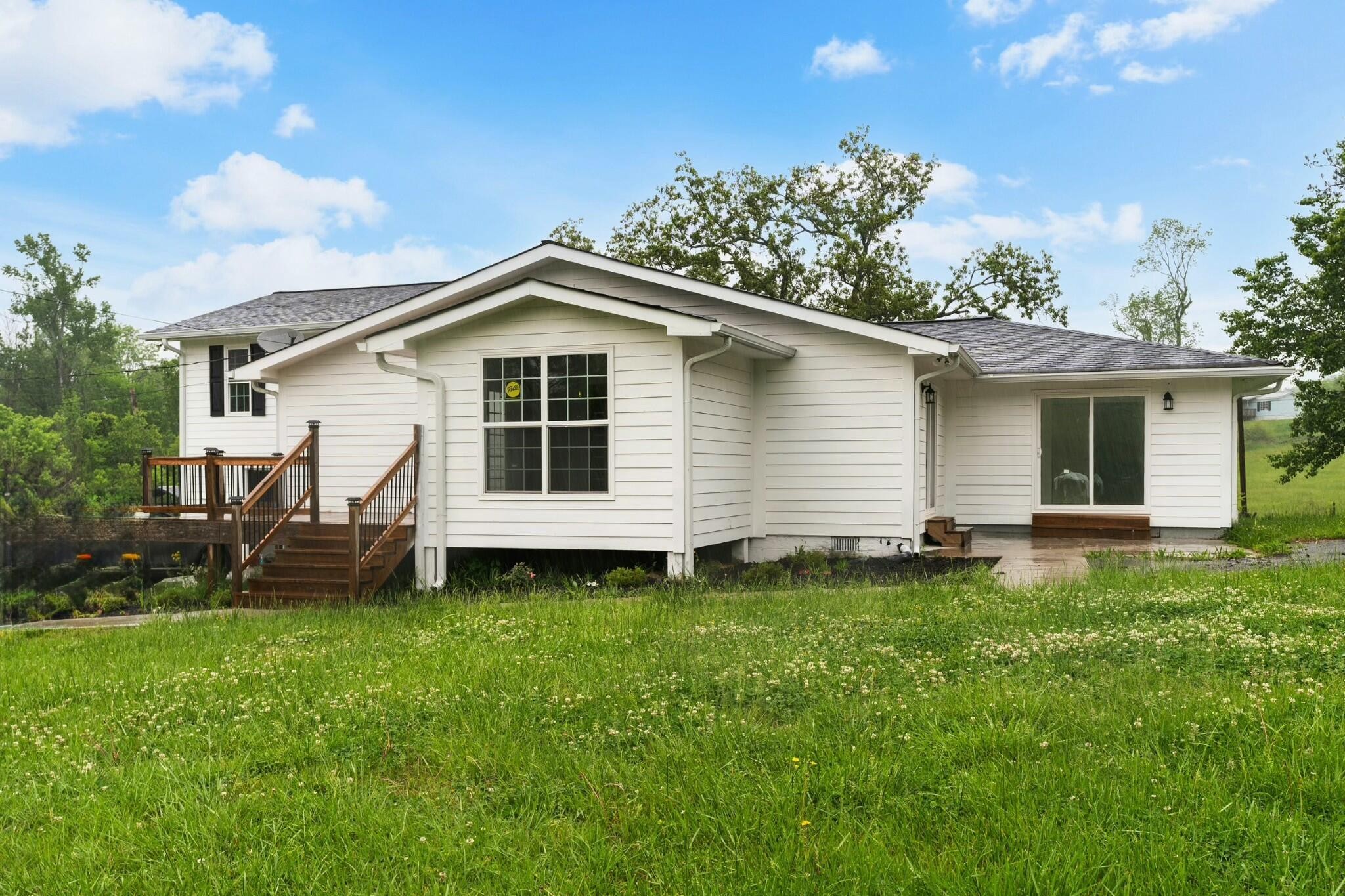 6416 Spring Place Road Southeast Cleveland, TN 37323 - Photo 28 of 28 a front view of a house with a yard