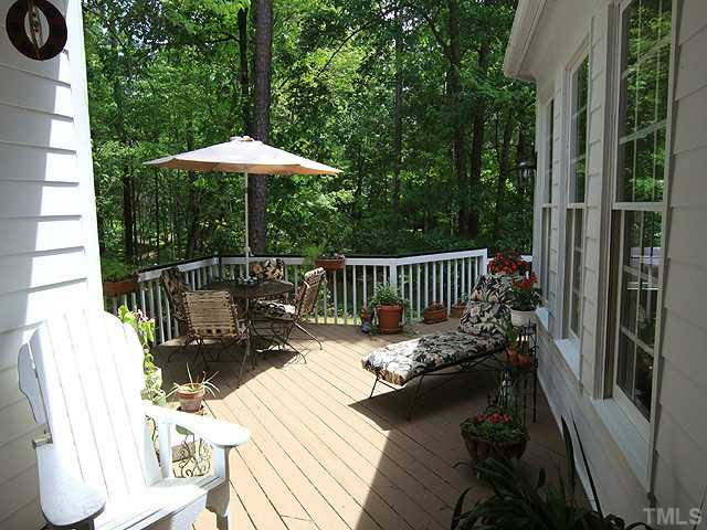 113 Raphael Drive Cary, NC 27511 - Photo 16 of 16 Porches, porches, porches! This is a picture of the back porch that can be accessed from the wide foyer or sunroom. The ultimate in privacy! Porch