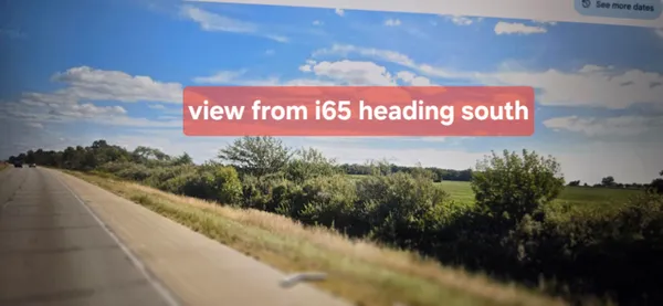 a view of a sign board with a lake view