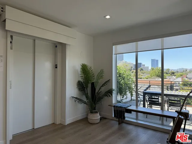 a table and chairs sitting in front of a house