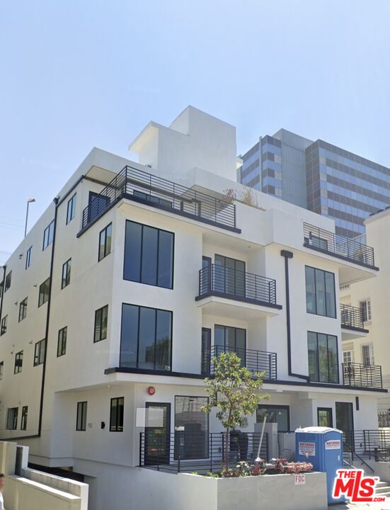 9842 Vidor Drive, Unit 402 Los Angeles, CA 90035 - Photo 23 of 23 a view of a building with a lot of windows