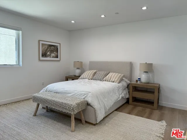 a bedroom with a bed and a table