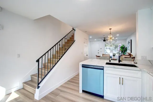 a view of kitchen with sink and microwave