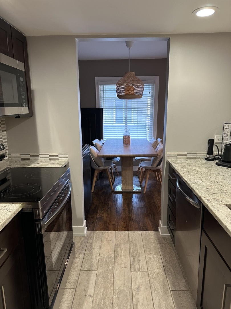 9830 Sayre Avenue, Unit 13 Chicago Ridge, IL 60415 - Photo 14 of 34 a kitchen with a counter space cabinets and appliances