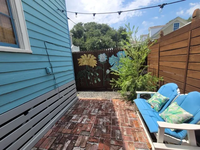 a view of a chairs and table in a patio