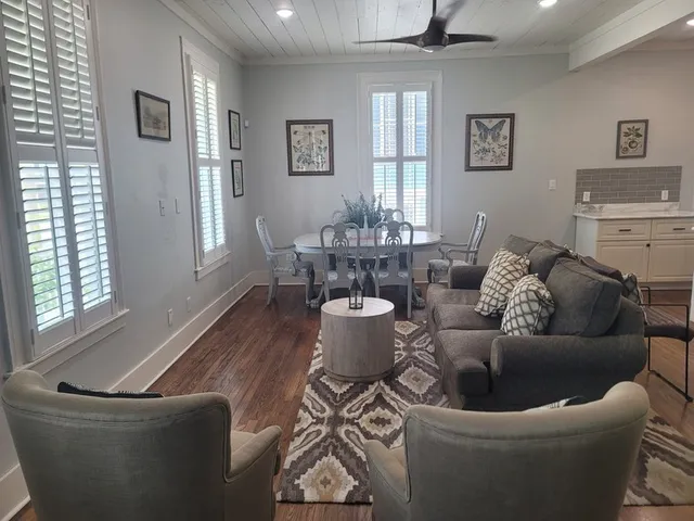 a living room with furniture and windows