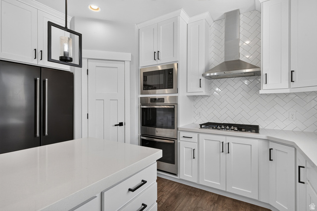 36 West Syracuse Road Vineyard, UT 84059 - Photo 19 of 56 Modern kitchen featuring white cabinetry, light-toned countertops, and wood-finish flooring