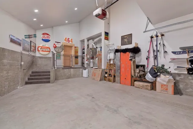 a view of a balcony with chairs and wooden floor