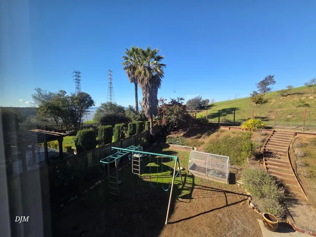 a view of swimming pool from a balcony
