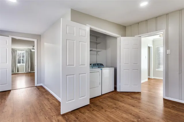 a spacious bedroom with a bed and window