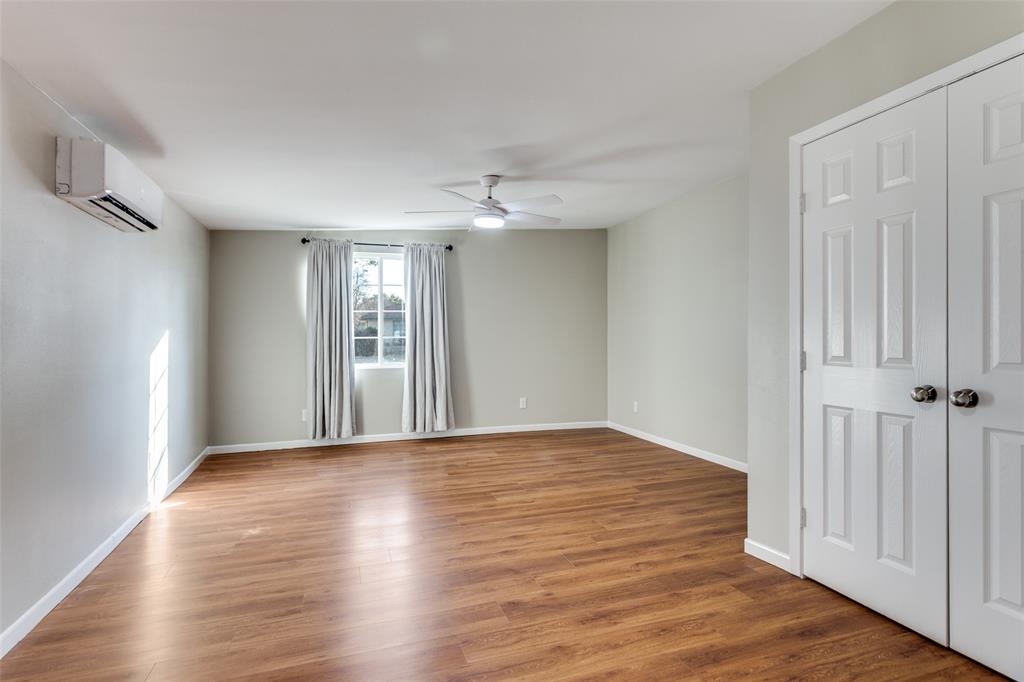 4045 Carolyn Road Fort Worth, TX 76109 - Photo 16 of 28 a view of an empty room with window and wooden floor