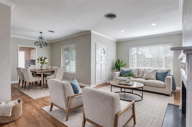 a living room with furniture and a table
