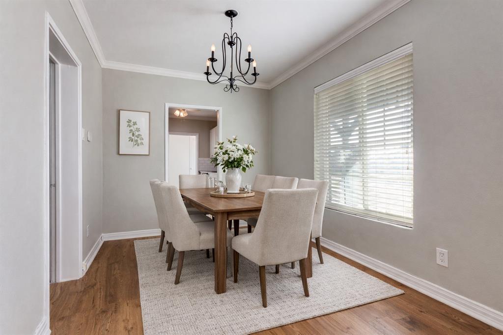 4045 Carolyn Road Fort Worth, TX 76109 - Photo 5 of 28 a dining room with furniture a chandelier and wooden floor