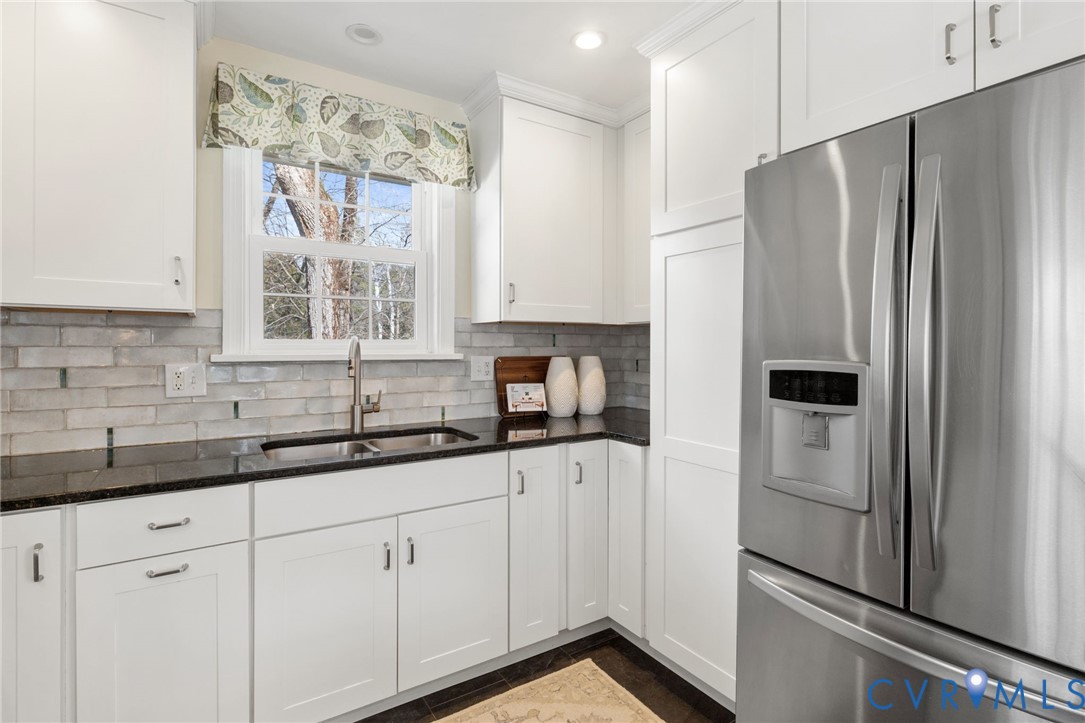 8678 Fieldcrest Road Richmond, VA 23235 - Photo 13 of 52 Sink over the window overlooks the rear yard. The