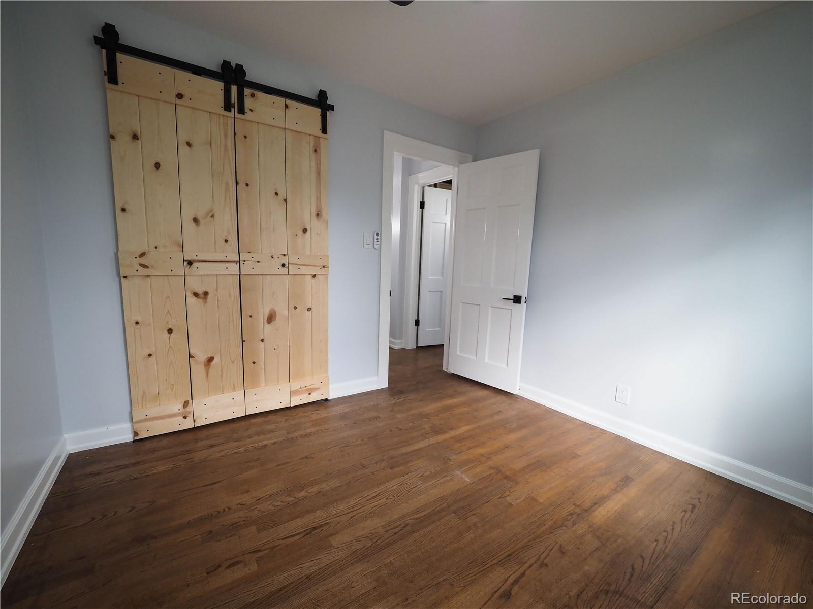6751 South Downing Circle West Centennial, CO 80122 - Photo 15 of 34 a view of an empty room with wooden floor