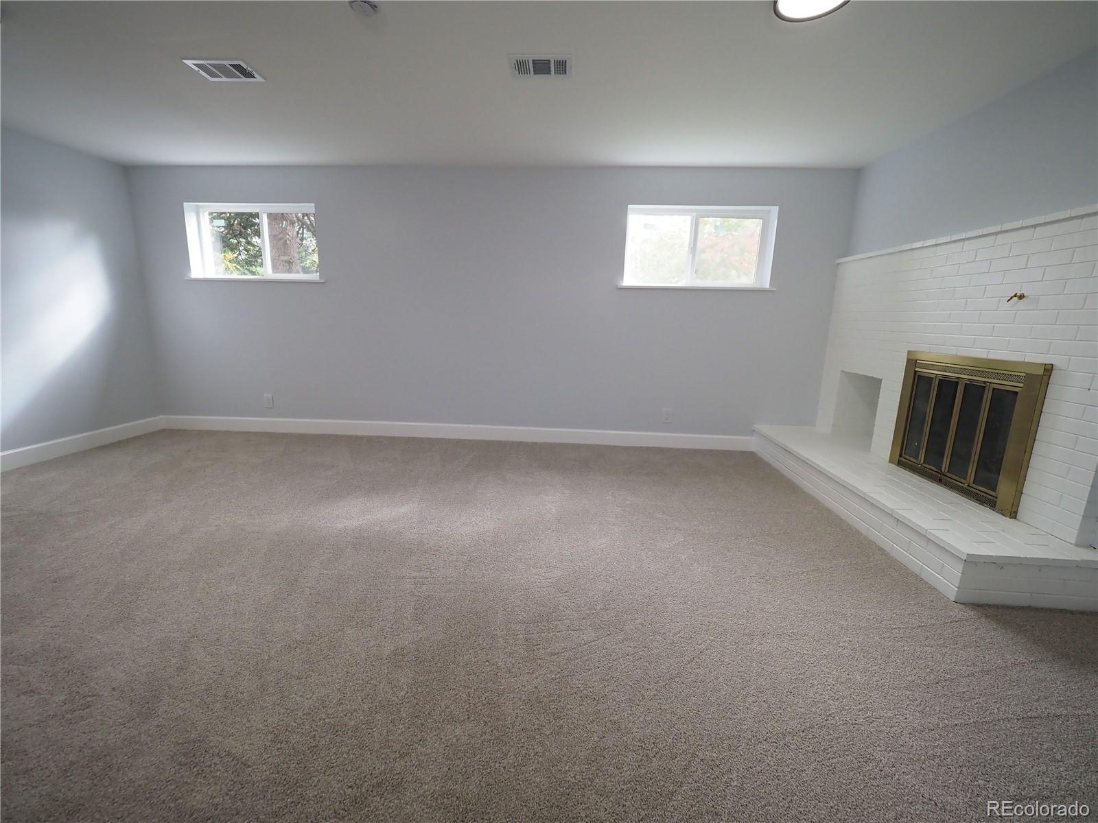 6751 South Downing Circle West Centennial, CO 80122 - Photo 17 of 34 an empty room with windows and closet