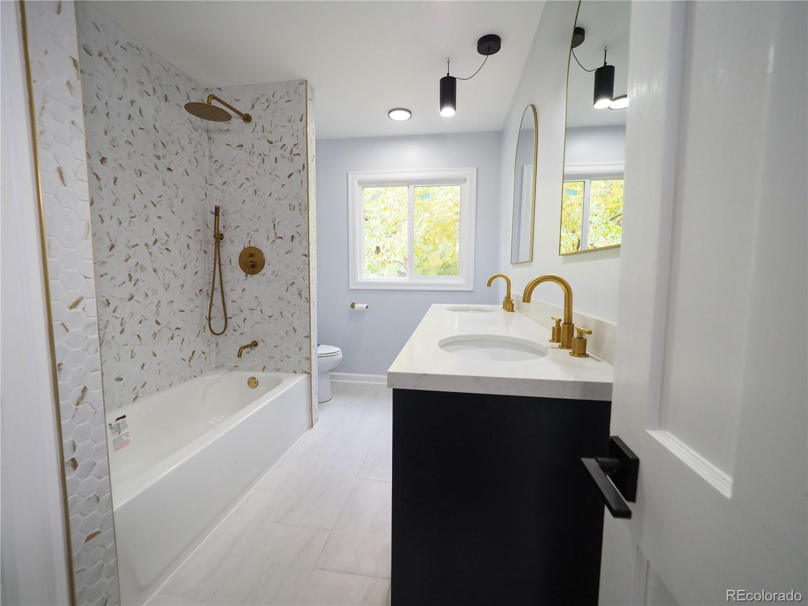 6751 South Downing Circle West Centennial, CO 80122 - Photo 10 of 34 a bathroom with a sink and a bathtub