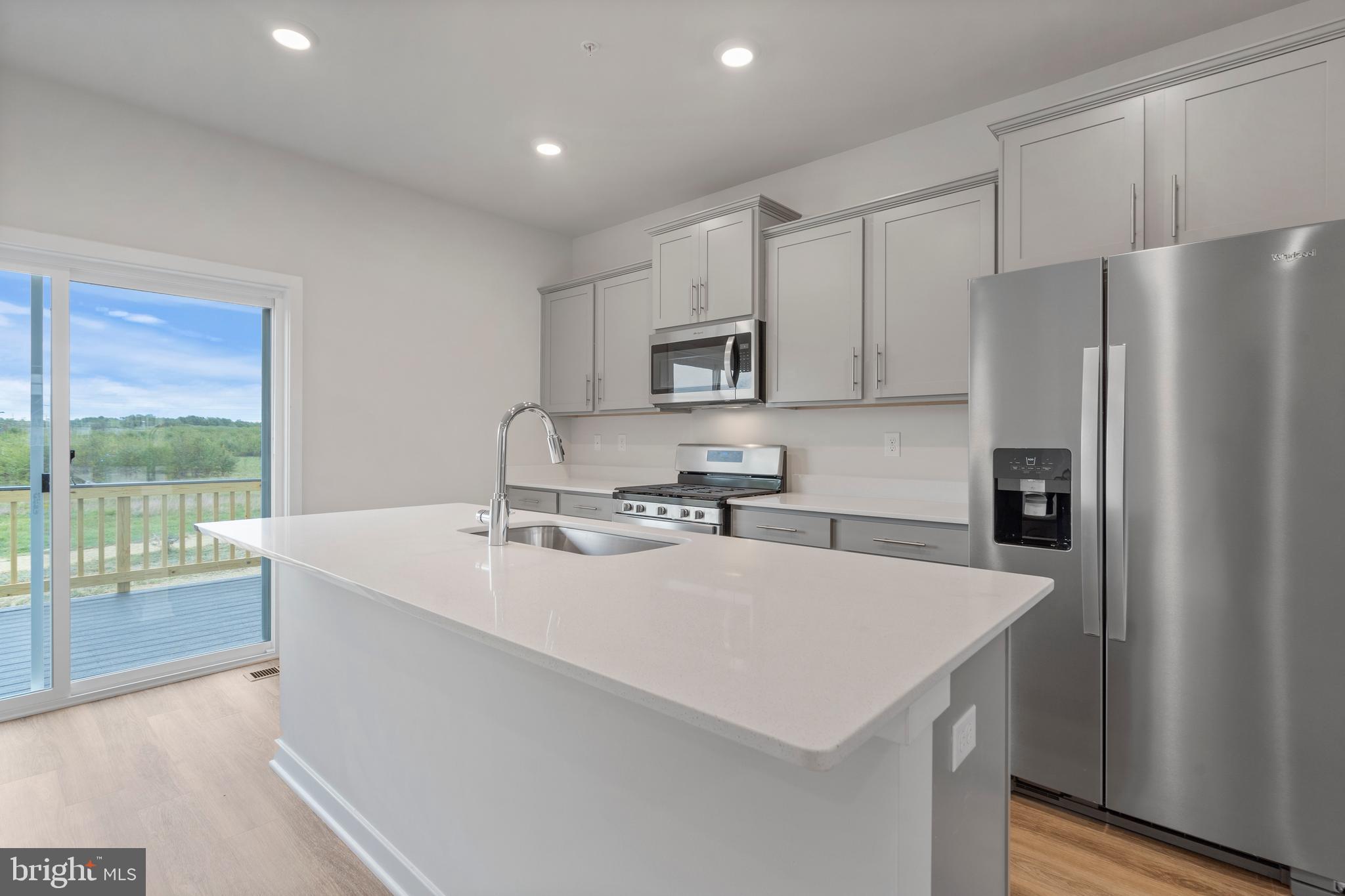 7520 Silver Thread Way Brandywine, MD 20613 - Photo 14 of 32 a kitchen with stainless steel appliances a microwave sink and refrigerator