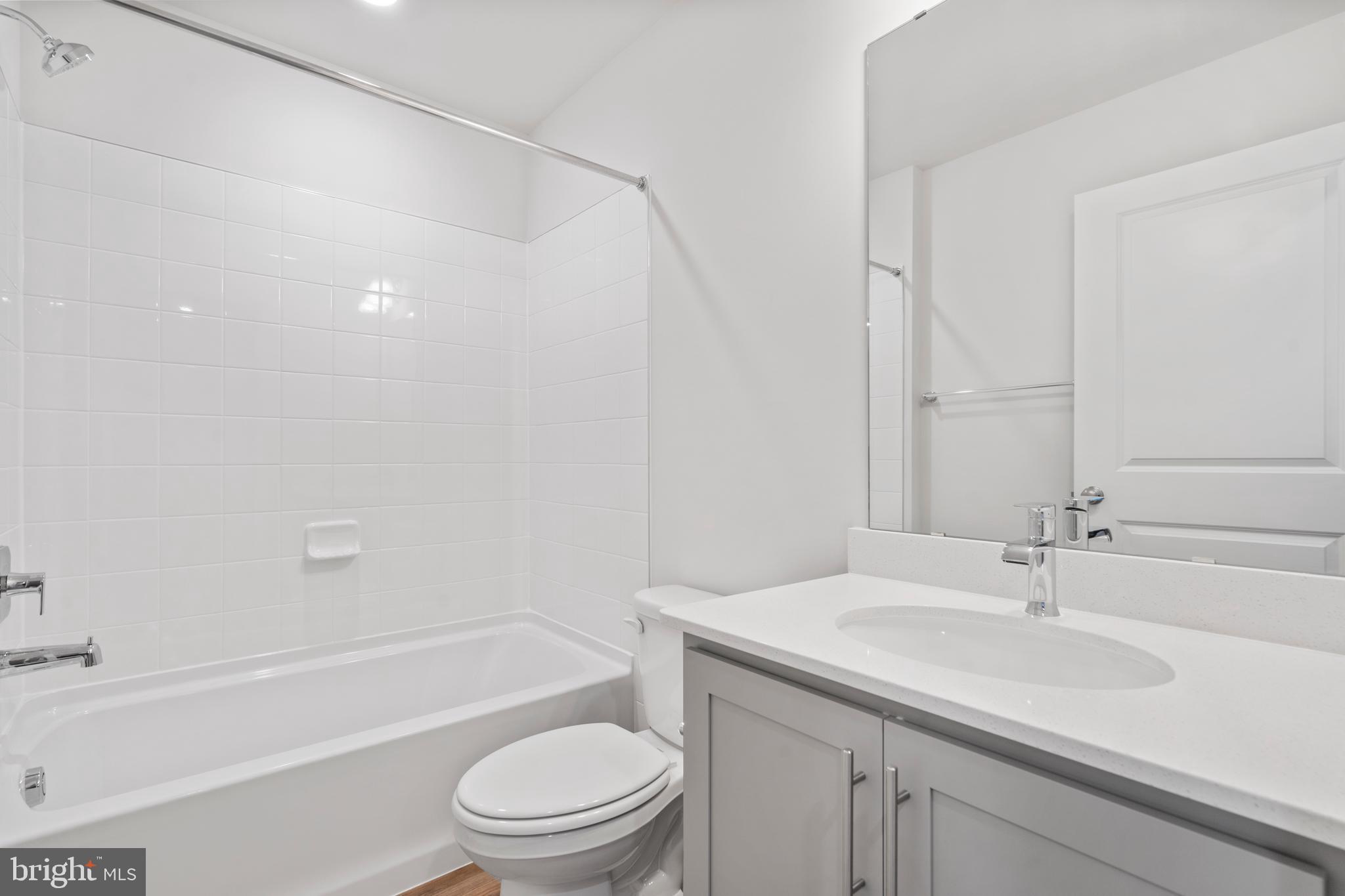 7520 Silver Thread Way Brandywine, MD 20613 - Photo 18 of 32 a bathroom with a sink a toilet and a bathtub