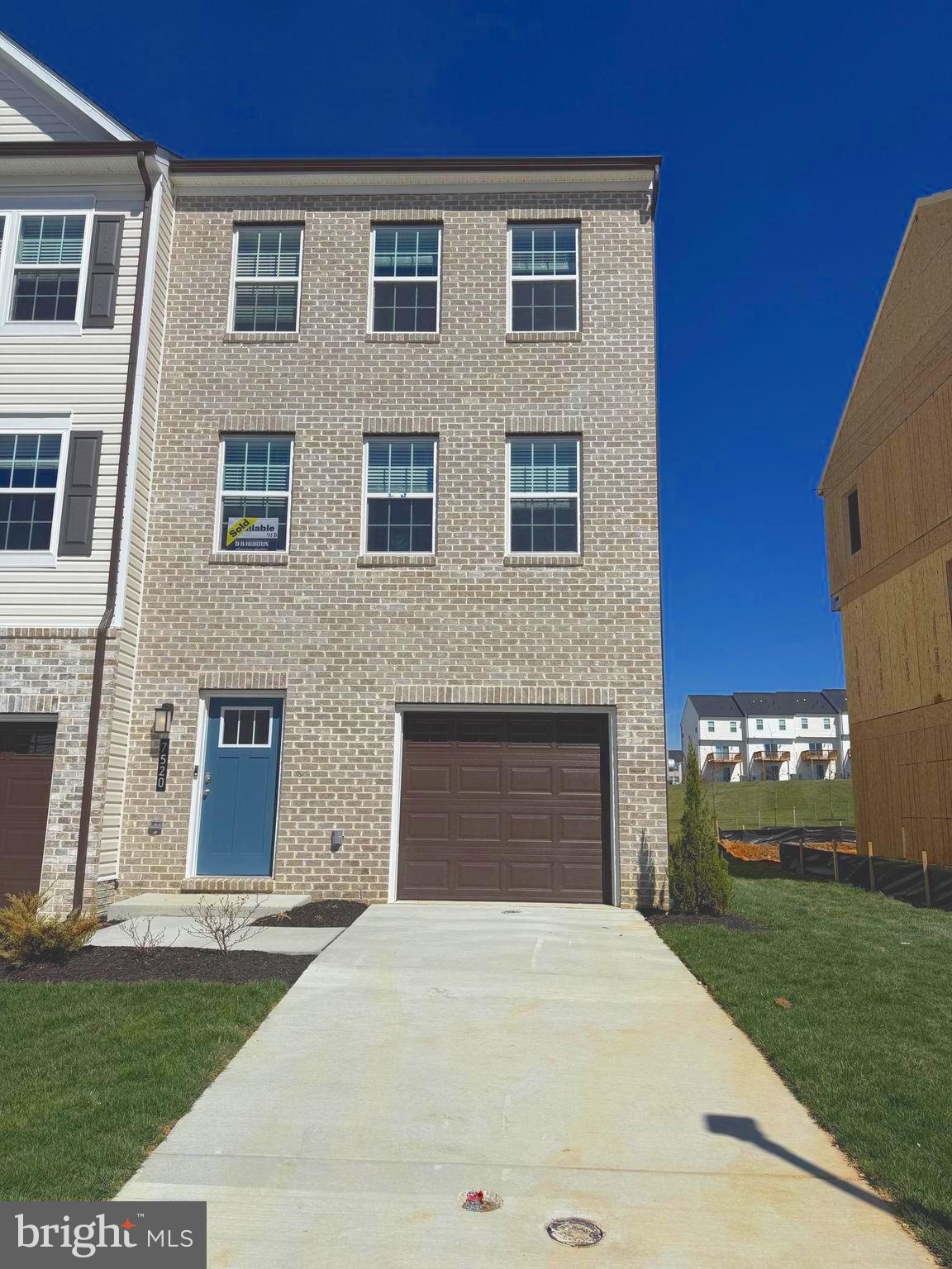 7520 Silver Thread Way Brandywine, MD 20613 - Photo 2 of 32 a front view of a house with a yard and garage
