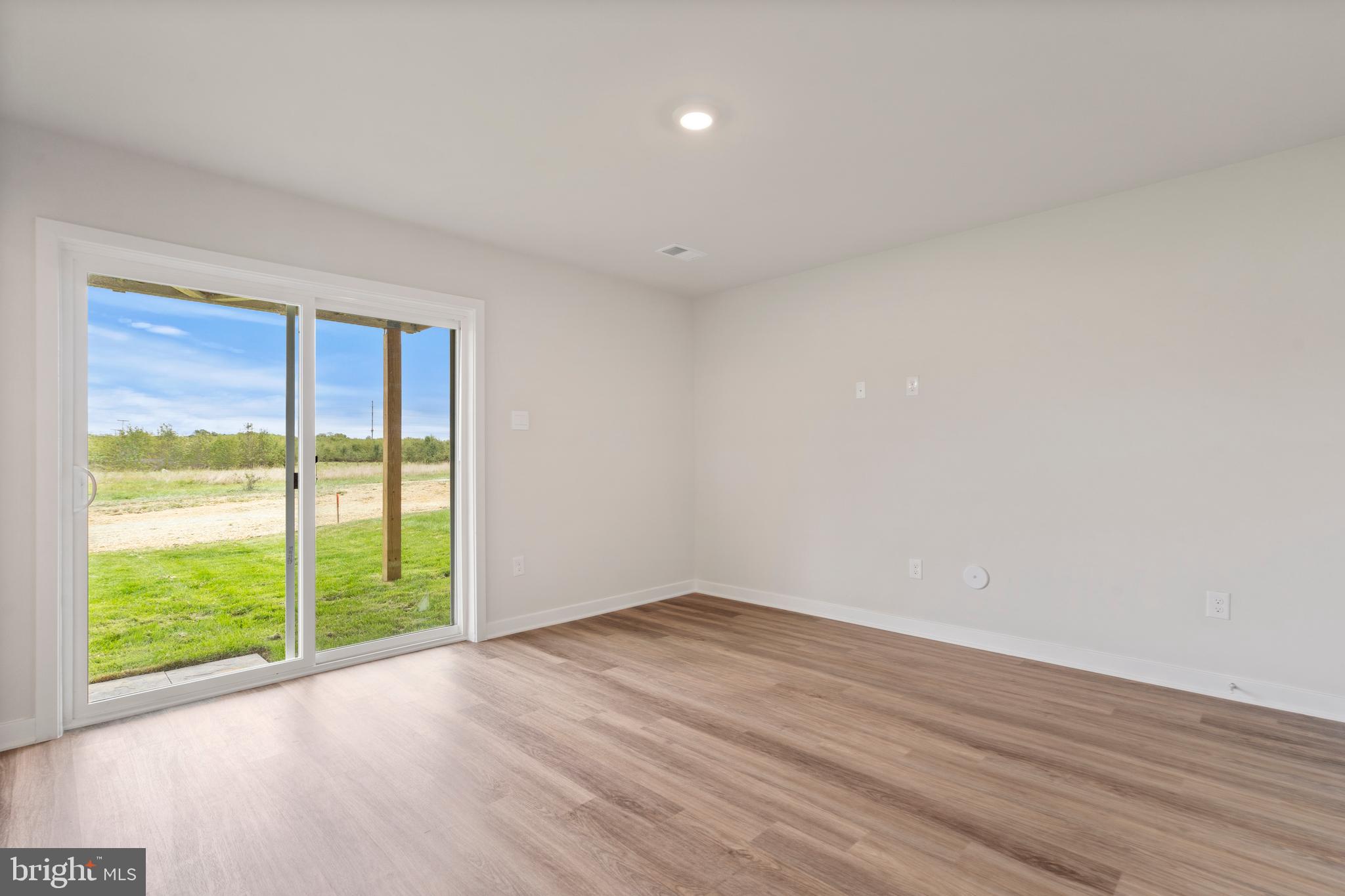 7520 Silver Thread Way Brandywine, MD 20613 - Photo 28 of 32 a view of an empty room with wooden floor and a window