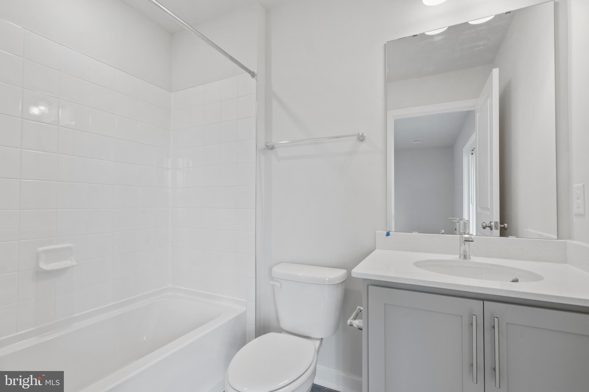 7520 Silver Thread Way Brandywine, MD 20613 - Photo 30 of 32 a bathroom with a sink toilet and shower