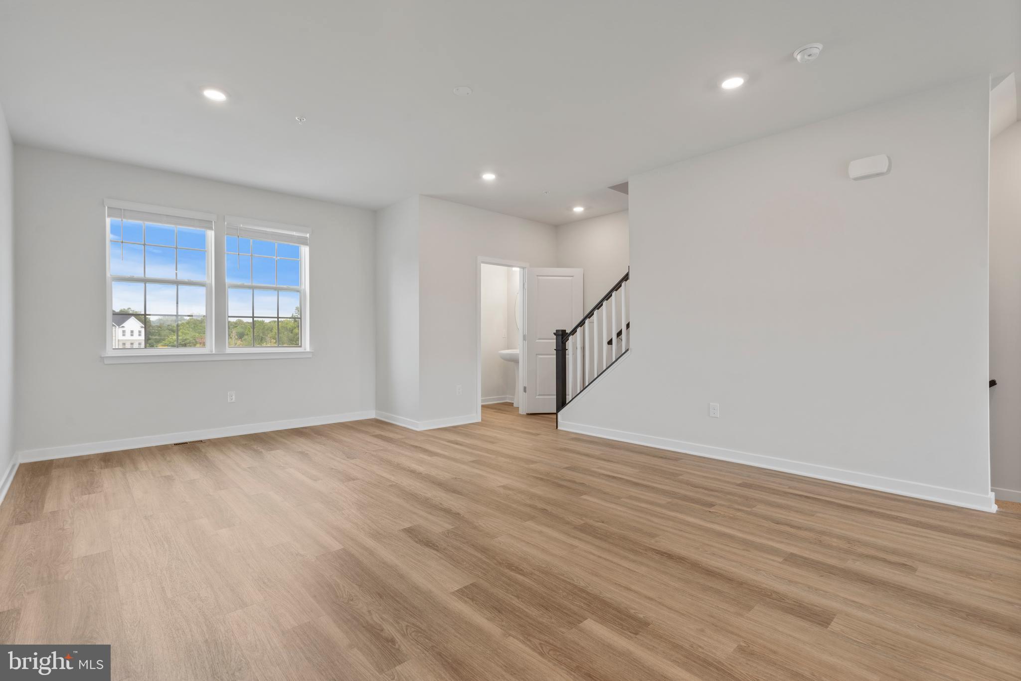 7520 Silver Thread Way Brandywine, MD 20613 - Photo 5 of 32 an empty room with wooden floor and windows