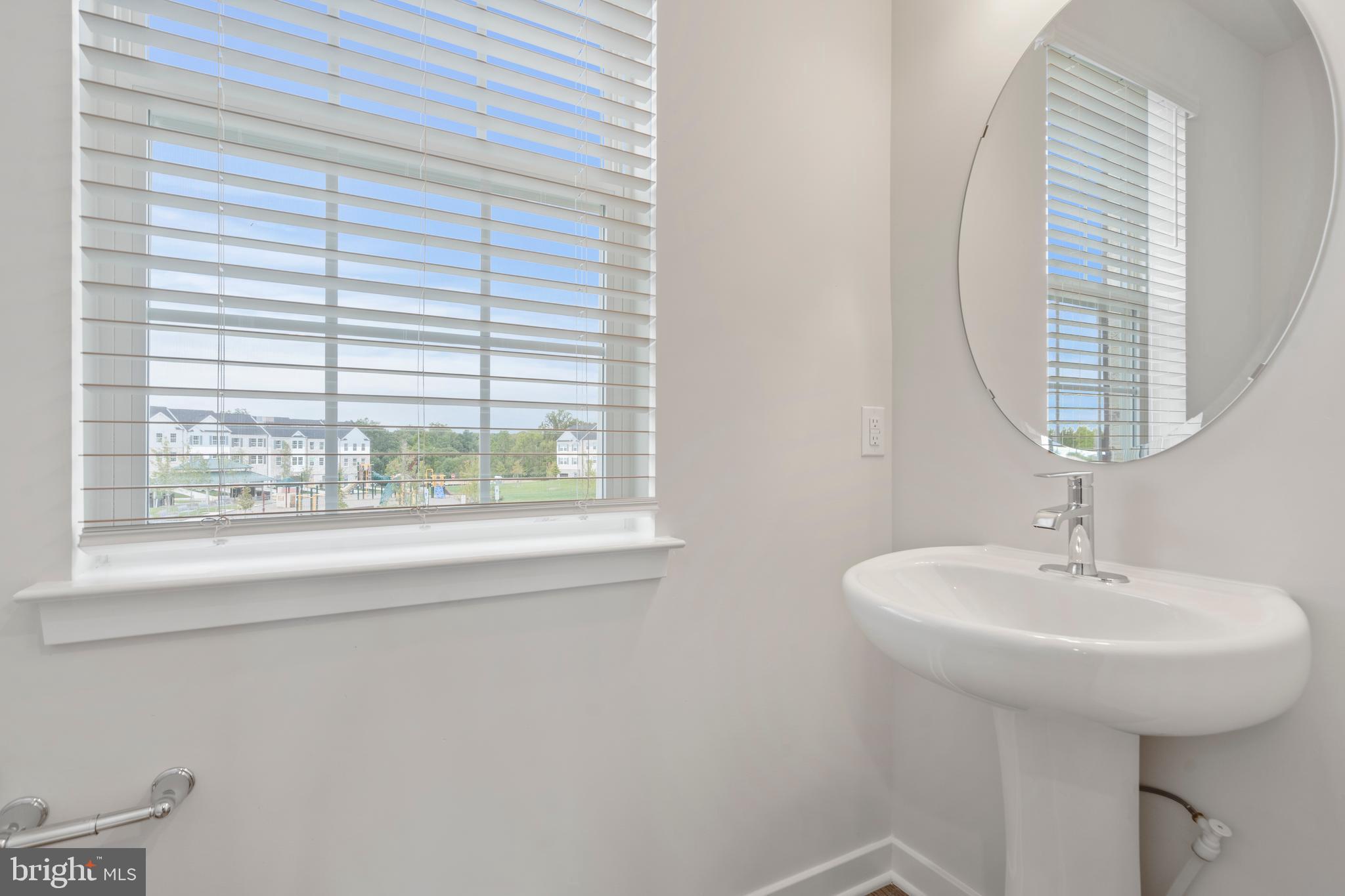 7520 Silver Thread Way Brandywine, MD 20613 - Photo 8 of 32 a bathroom with a sink and a mirror