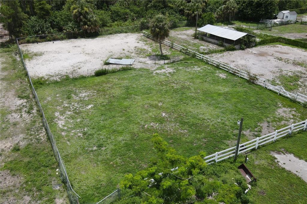 2400 Oil Well Road Naples, FL 34120 - Photo 14 of 35 a backyard of a house with lots of green space