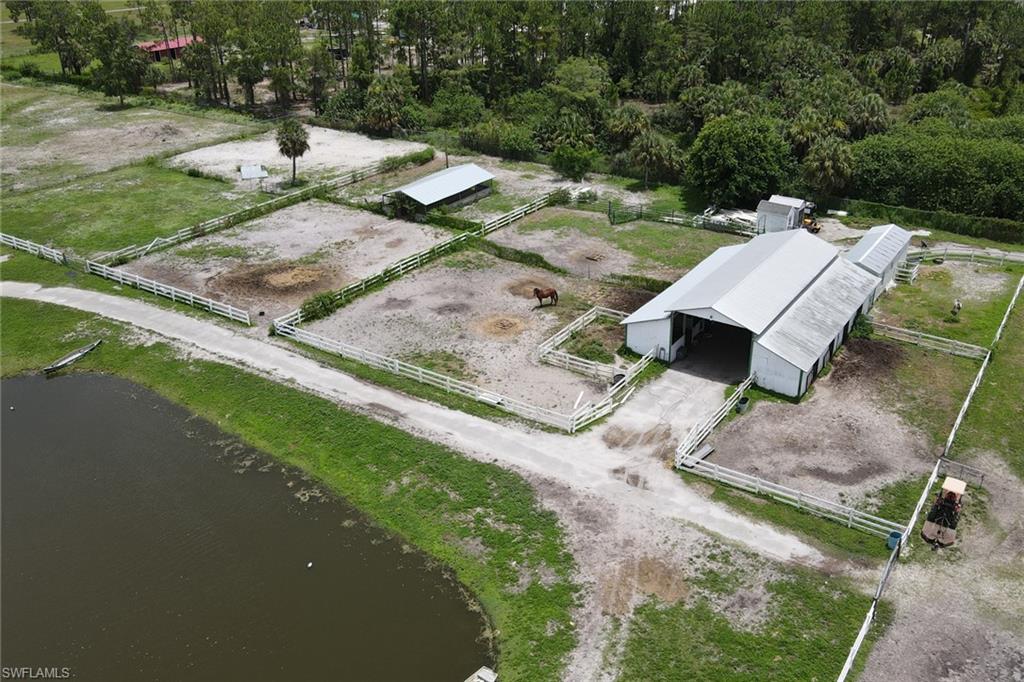 2400 Oil Well Road Naples, FL 34120 - Photo 16 of 35 an aerial view of a house with a yard