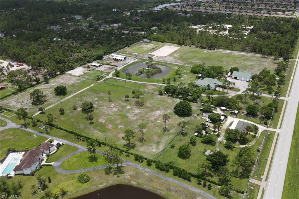 2400 Oil Well Road Naples, FL 34120 - Photo 18 of 35 an aerial view of a residential houses with outdoor space