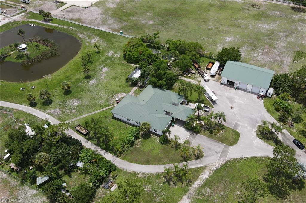 2400 Oil Well Road Naples, FL 34120 - Photo 2 of 35 an aerial view of a residential houses with outdoor space