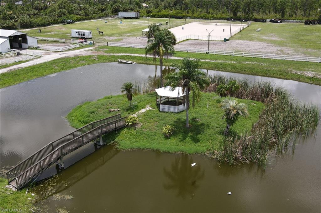 2400 Oil Well Road Naples, FL 34120 - Photo 24 of 35 a view of a lake with a terrace