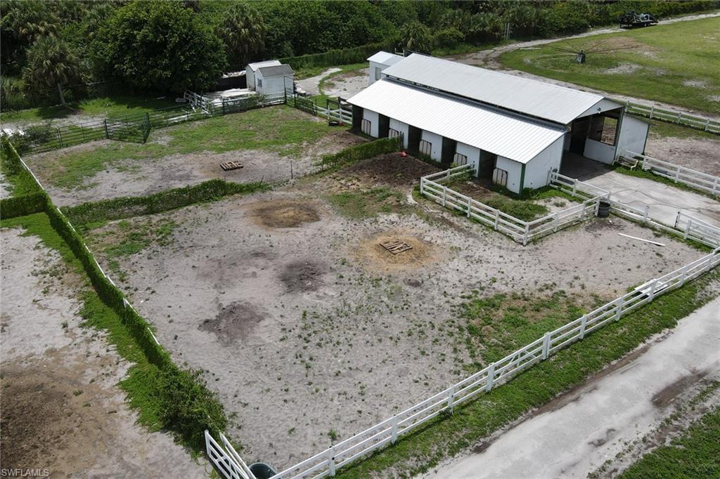 2400 Oil Well Road Naples, FL 34120 - Photo 28 of 35 a view of a backyard with wooden fence