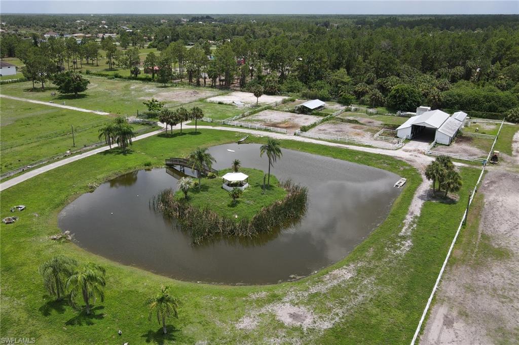 2400 Oil Well Road Naples, FL 34120 - Photo 30 of 35 a view of a lake with a yard