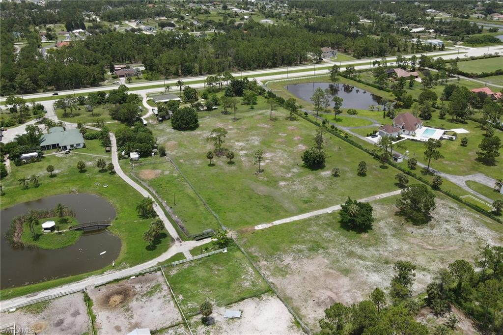 2400 Oil Well Road Naples, FL 34120 - Photo 33 of 35 an aerial view of residential houses with outdoor space