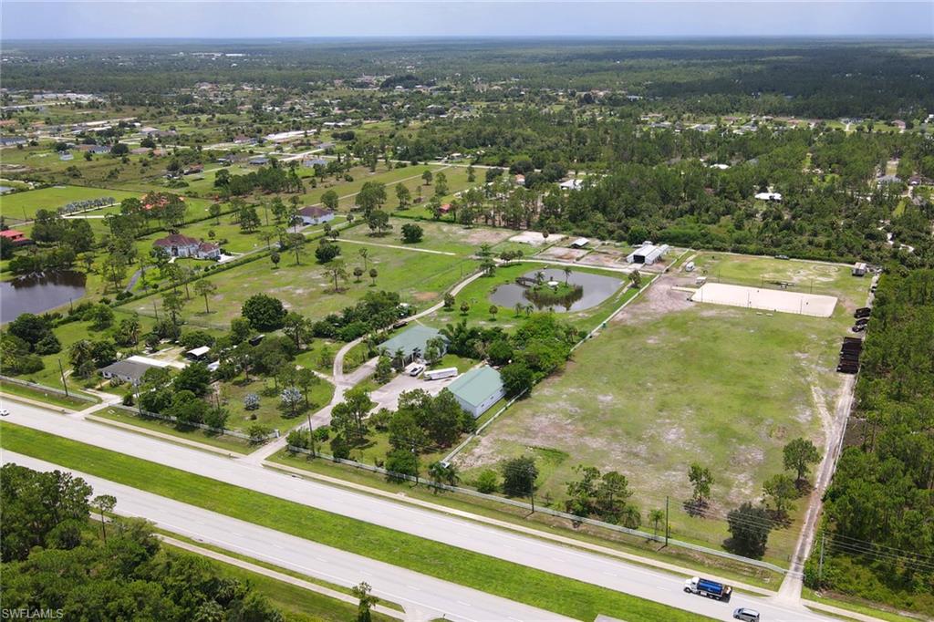 2400 Oil Well Road Naples, FL 34120 - Photo 35 of 35 an aerial view of residential houses with outdoor space and mountain view